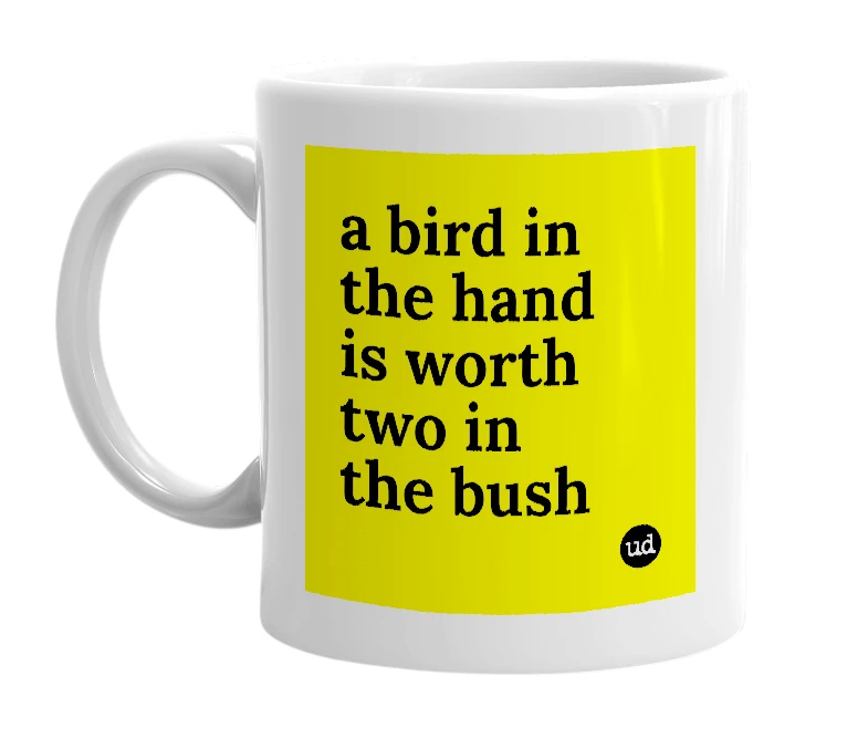 White mug with 'a bird in the hand is worth two in the bush' in bold black letters