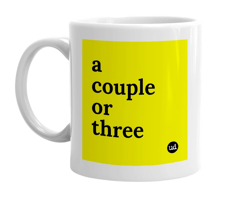 White mug with 'a couple or three' in bold black letters