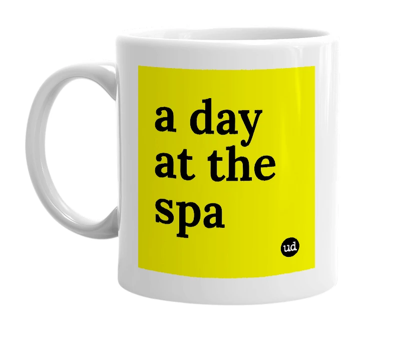 White mug with 'a day at the spa' in bold black letters