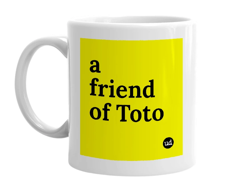 White mug with 'a friend of Toto' in bold black letters