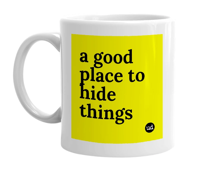 White mug with 'a good place to hide things' in bold black letters