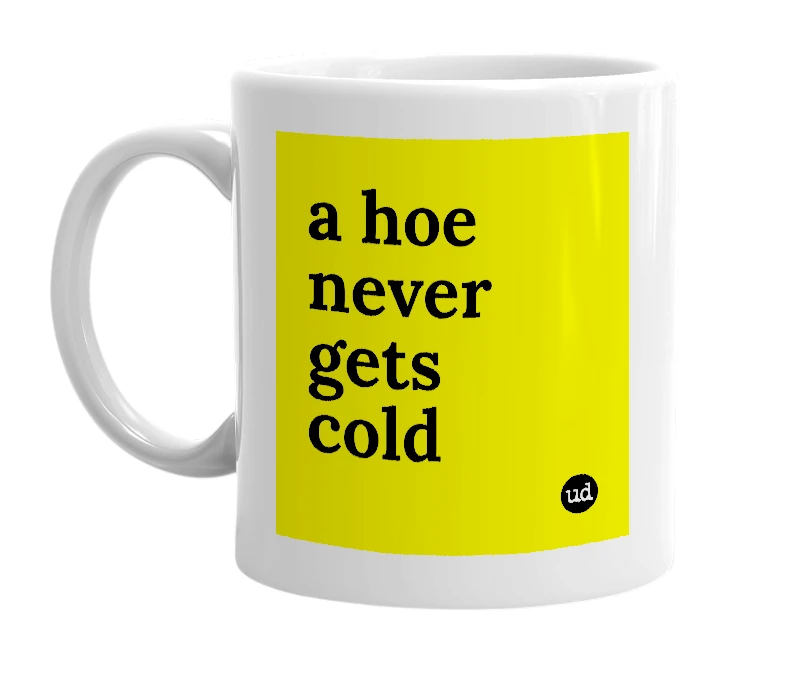 White mug with 'a hoe never gets cold' in bold black letters