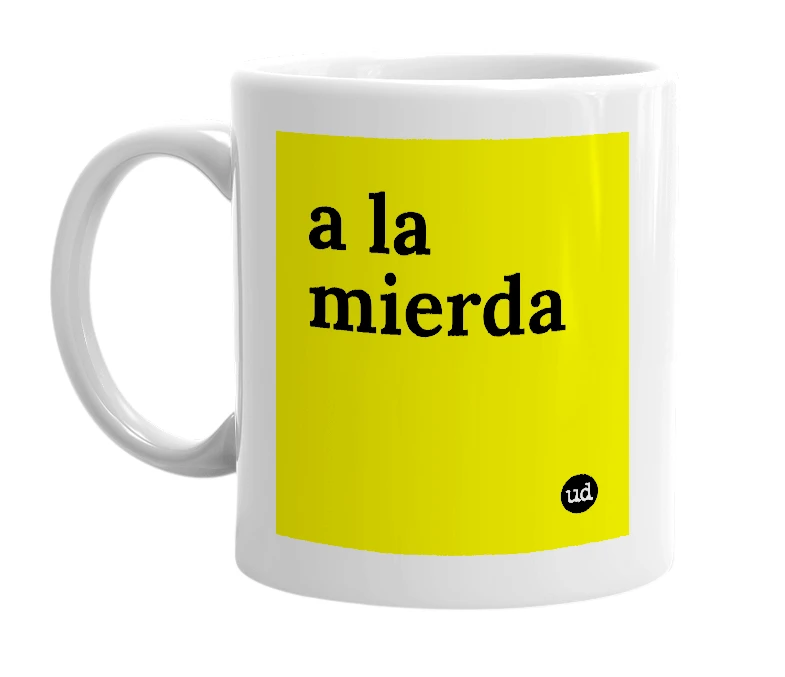 White mug with 'a la mierda' in bold black letters