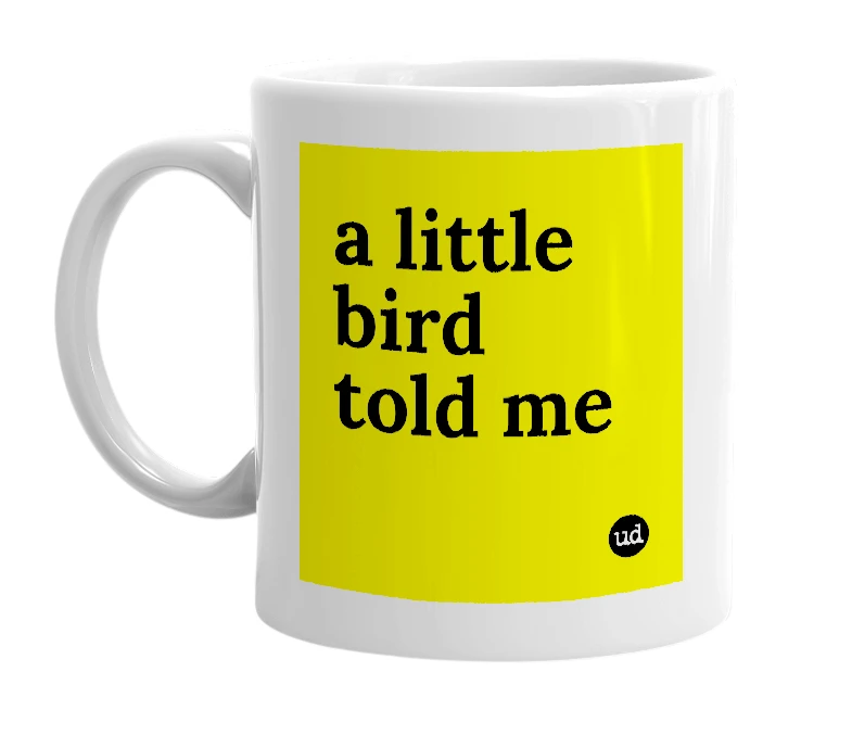 White mug with 'a little bird told me' in bold black letters