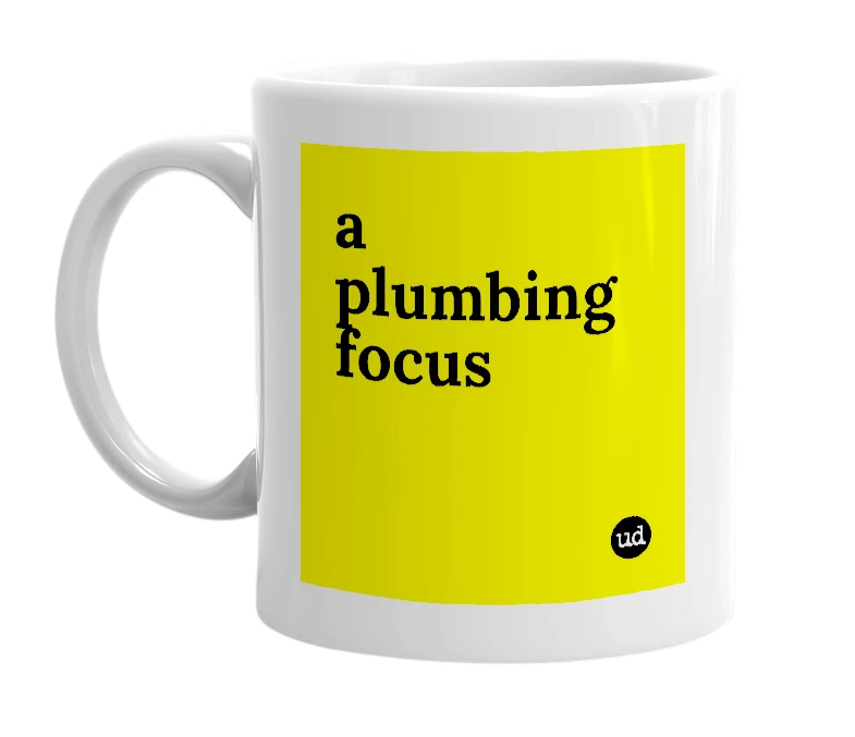 White mug with 'a plumbing focus' in bold black letters