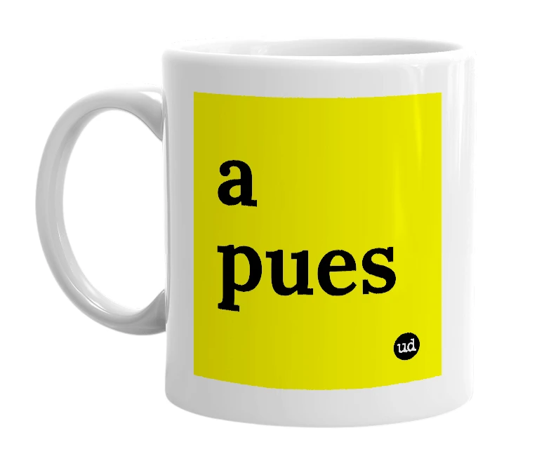 White mug with 'a pues' in bold black letters