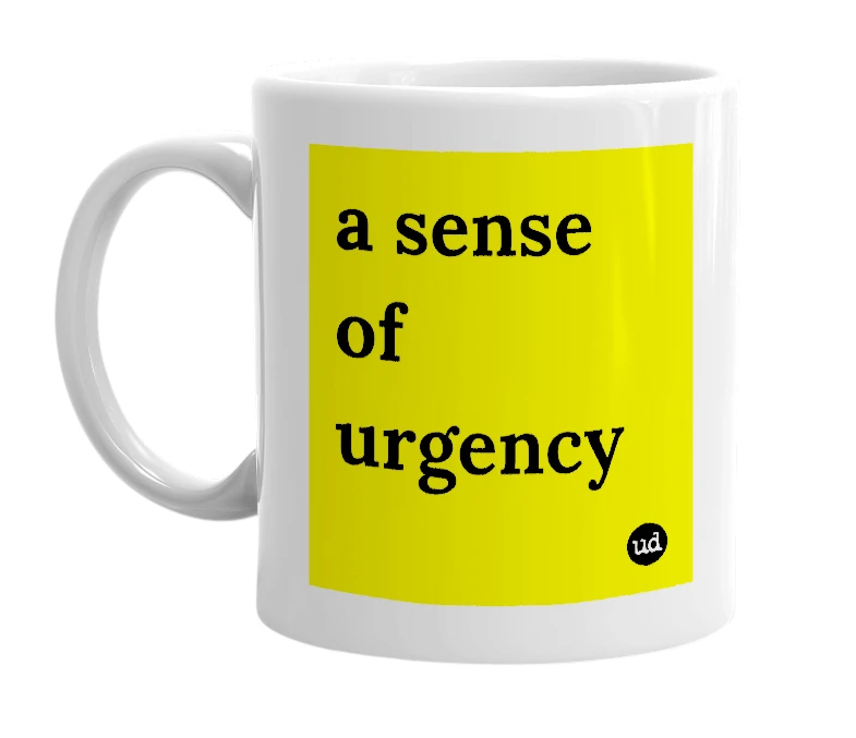 White mug with 'a sense of urgency' in bold black letters