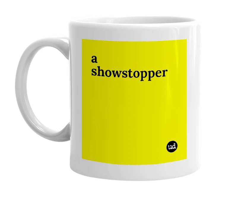 White mug with 'a showstopper' in bold black letters