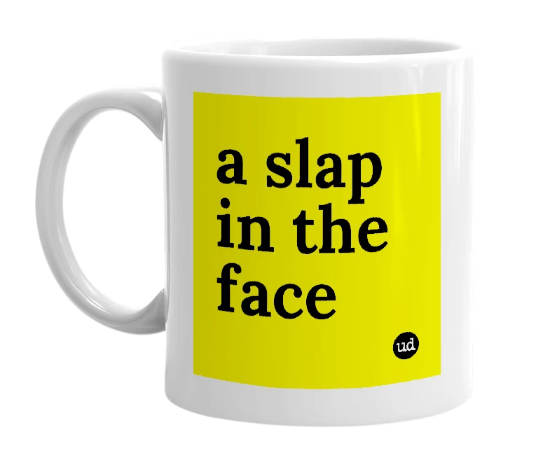 White mug with 'a slap in the face' in bold black letters