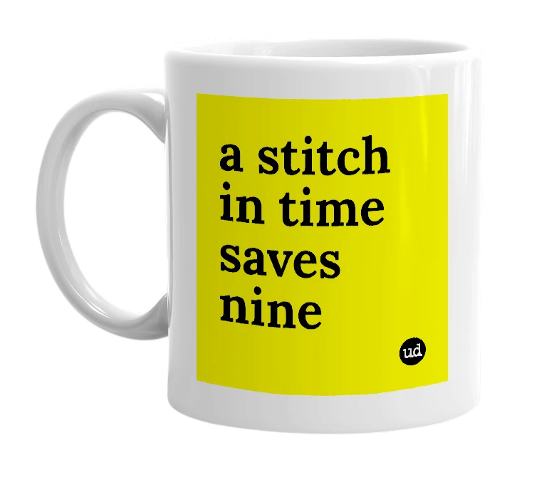 White mug with 'a stitch in time saves nine' in bold black letters