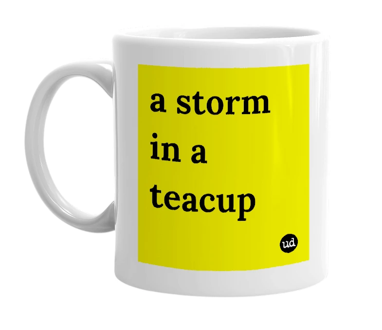 White mug with 'a storm in a teacup' in bold black letters