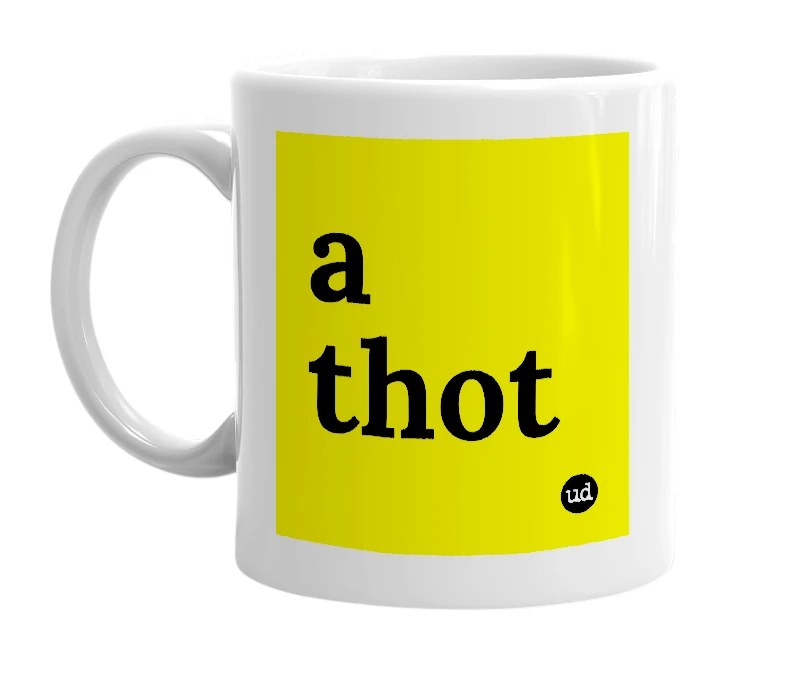 White mug with 'a thot' in bold black letters