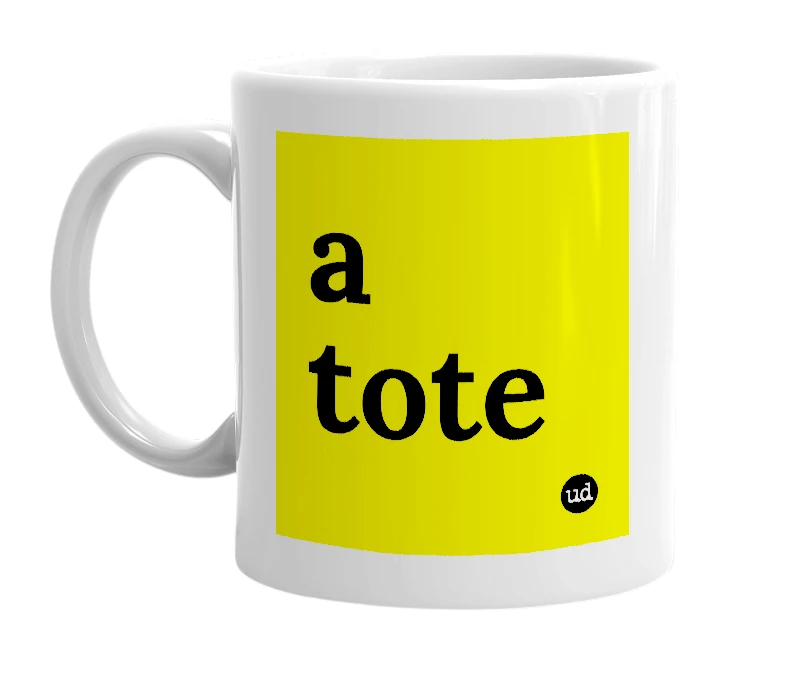 White mug with 'a tote' in bold black letters