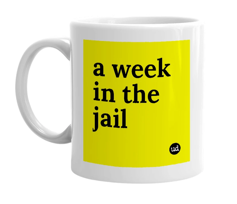 White mug with 'a week in the jail' in bold black letters