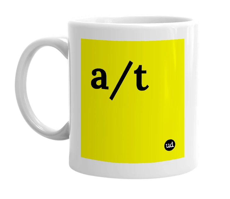 White mug with 'a/t' in bold black letters