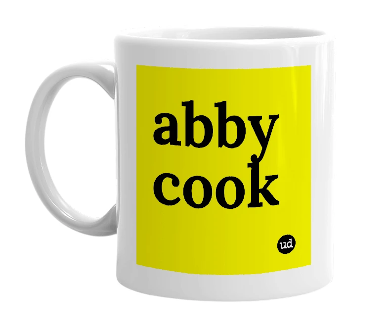 White mug with 'abby cook' in bold black letters