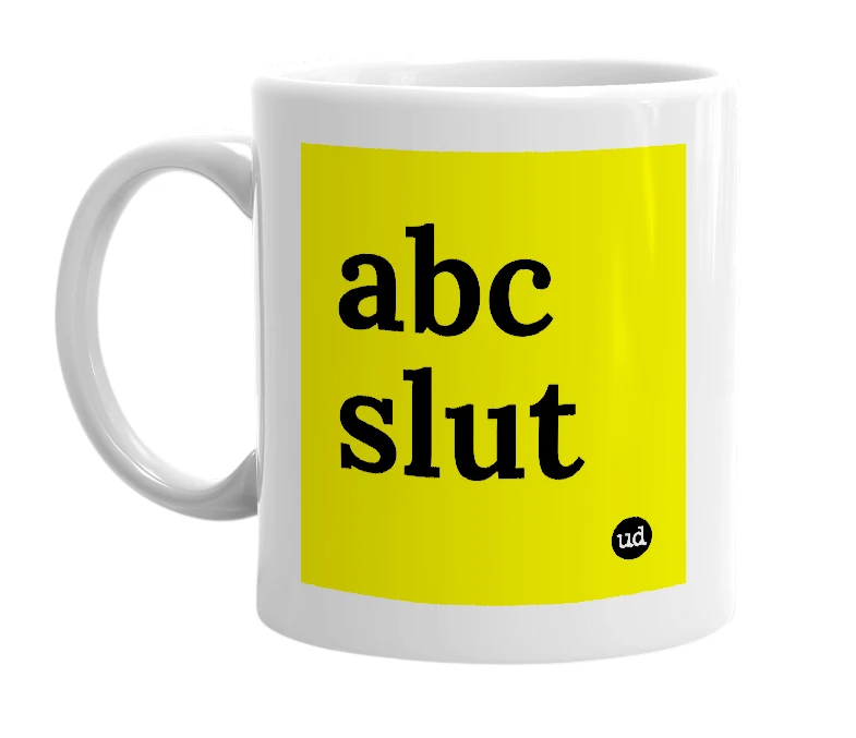 White mug with 'abc slut' in bold black letters