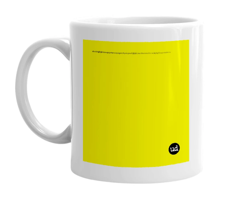 White mug with 'abcdefghijklmnopqrstuvwxyzqwertyuiopasdfghjkl;zxcvbnmmnbvcxzlkjhgfdsapoiuytrewqqazwsxedcrfvtgbyhnujmikolp' in bold black letters