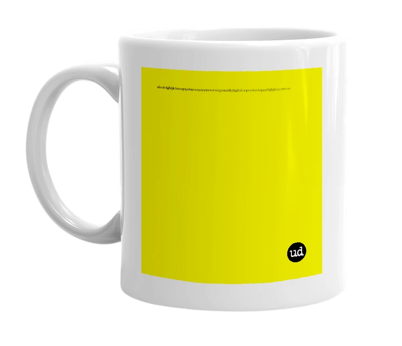White mug with 'abcdefghijklmnopqrstuvwxyzzyxwvutsrqponmlkjihgfedcaqwertyuiopasdfghjklzxcvbnmmnbvcxzlkjhgfdsapoiuytrewqqazwsxedcrfvtgbyhnujmikolp' in bold black letters