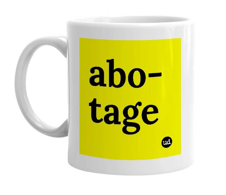 White mug with 'abo-tage' in bold black letters