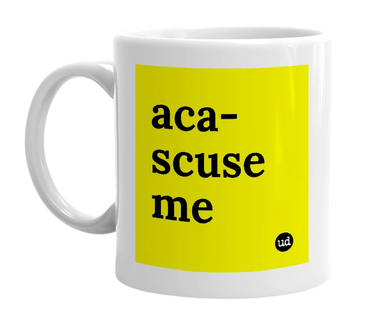 White mug with 'aca-scuse me' in bold black letters