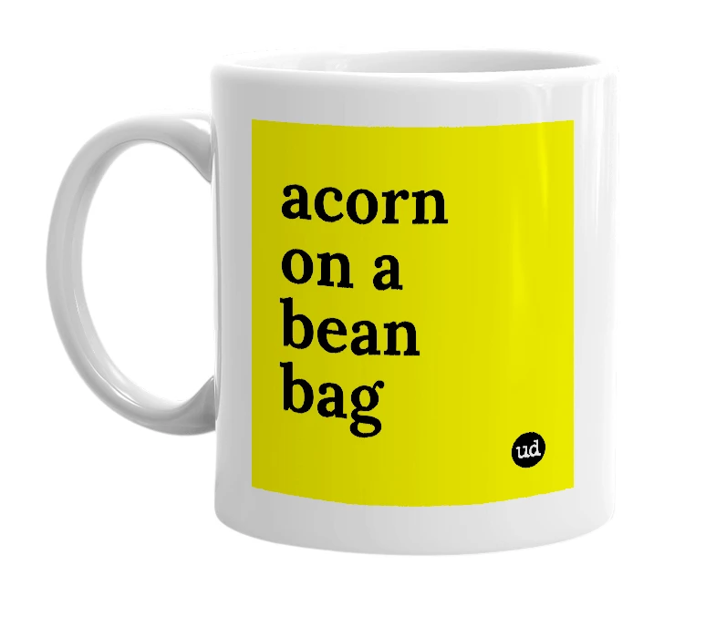White mug with 'acorn on a bean bag' in bold black letters