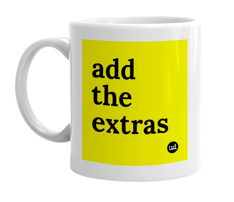 White mug with 'add the extras' in bold black letters