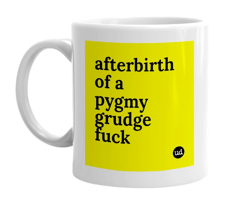 White mug with 'afterbirth of a pygmy grudge fuck' in bold black letters