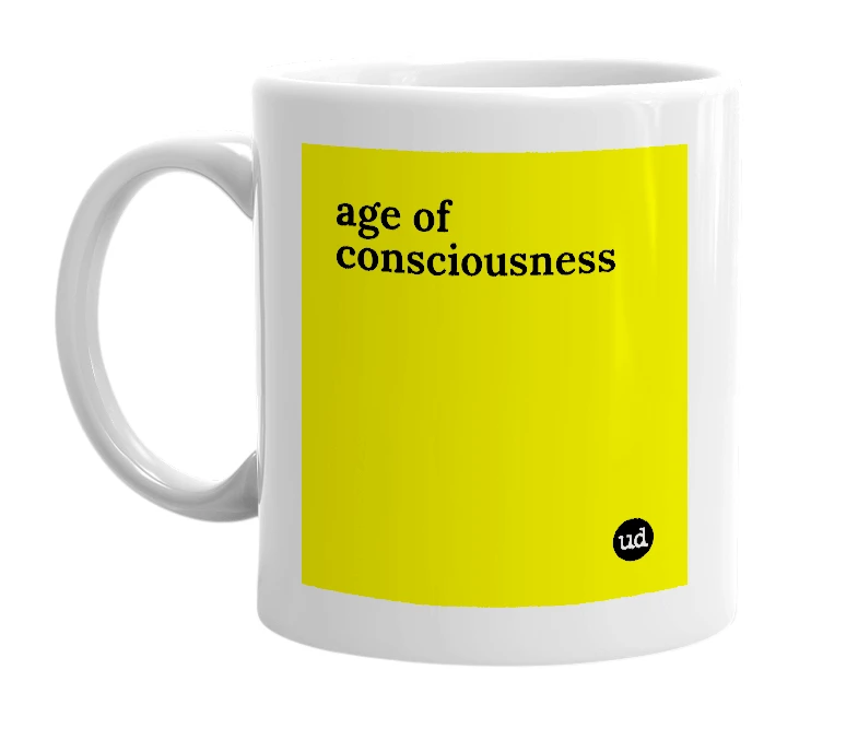 White mug with 'age of consciousness' in bold black letters