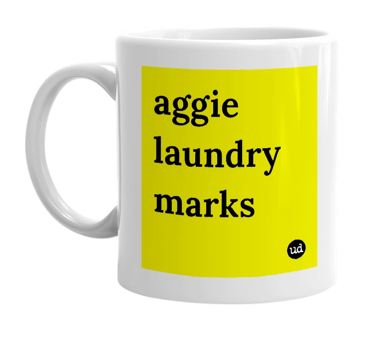 White mug with 'aggie laundry marks' in bold black letters