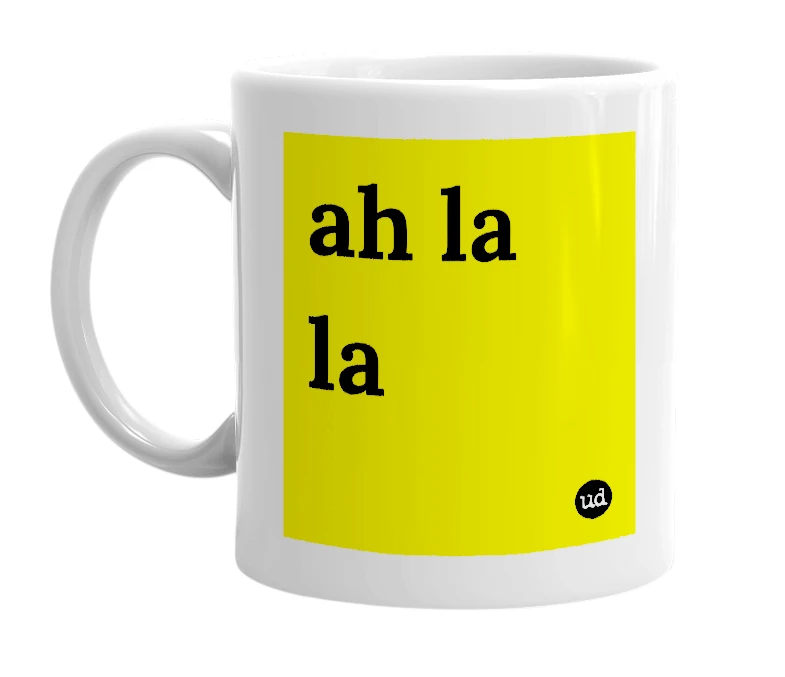 White mug with 'ah la la' in bold black letters