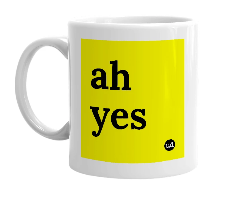 White mug with 'ah yes' in bold black letters