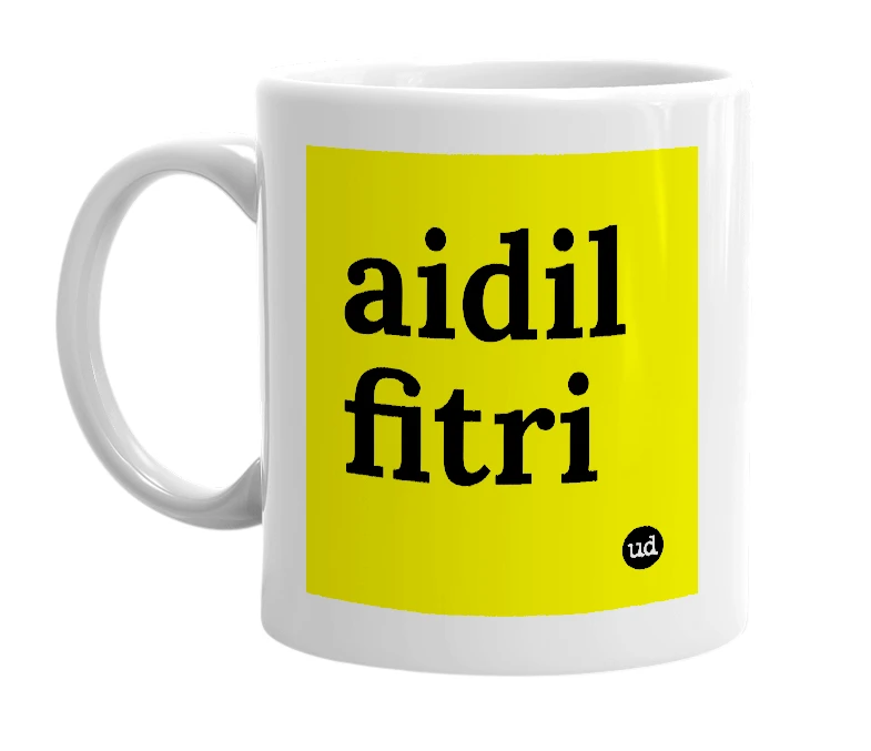 White mug with 'aidil fitri' in bold black letters
