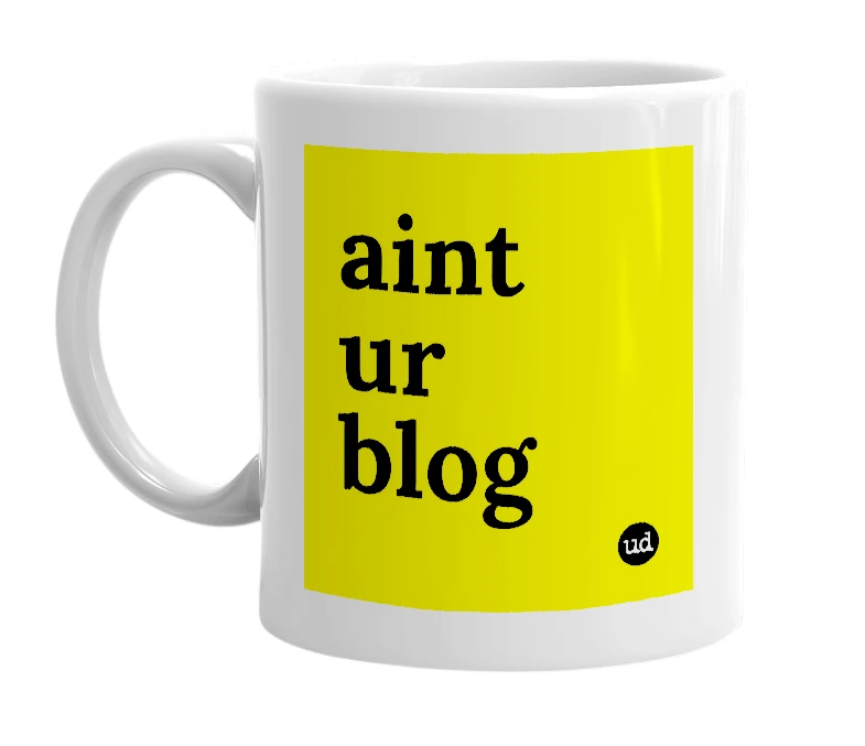 White mug with 'aint ur blog' in bold black letters