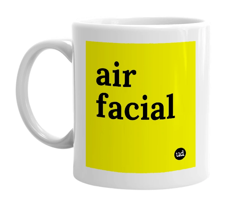 White mug with 'air facial' in bold black letters