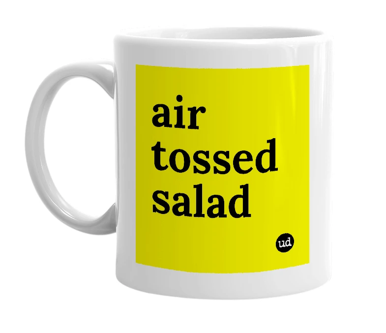 White mug with 'air tossed salad' in bold black letters