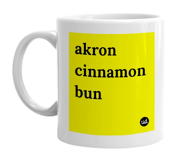 White mug with 'akron cinnamon bun' in bold black letters