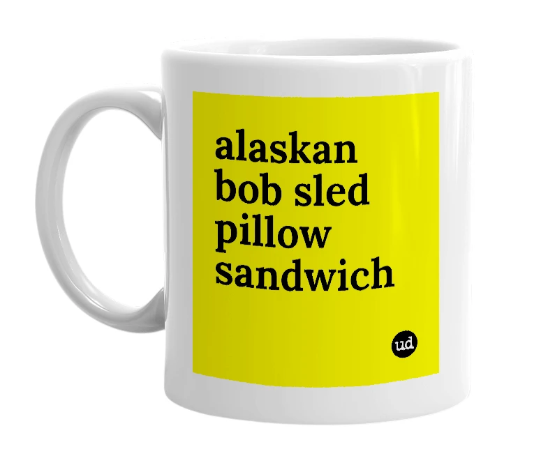 White mug with 'alaskan bob sled pillow sandwich' in bold black letters
