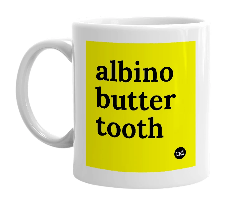 White mug with 'albino butter tooth' in bold black letters
