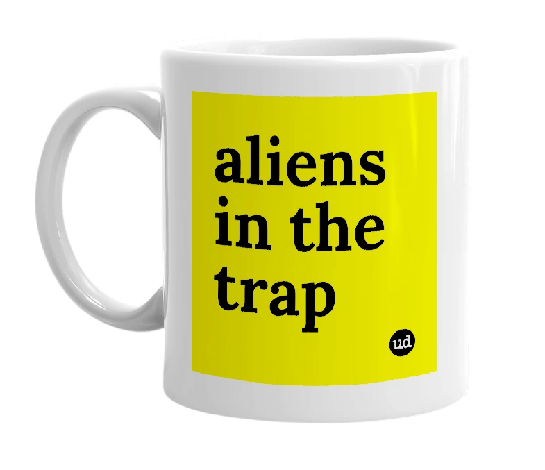 White mug with 'aliens in the trap' in bold black letters