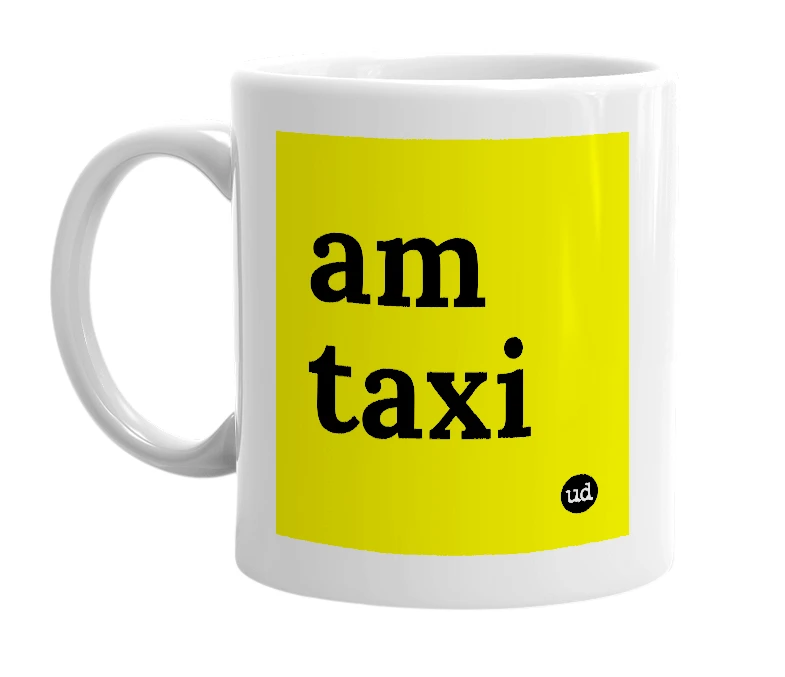 White mug with 'am taxi' in bold black letters