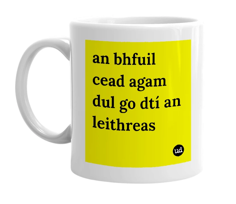 White mug with 'an bhfuil cead agam dul go dtí an leithreas' in bold black letters