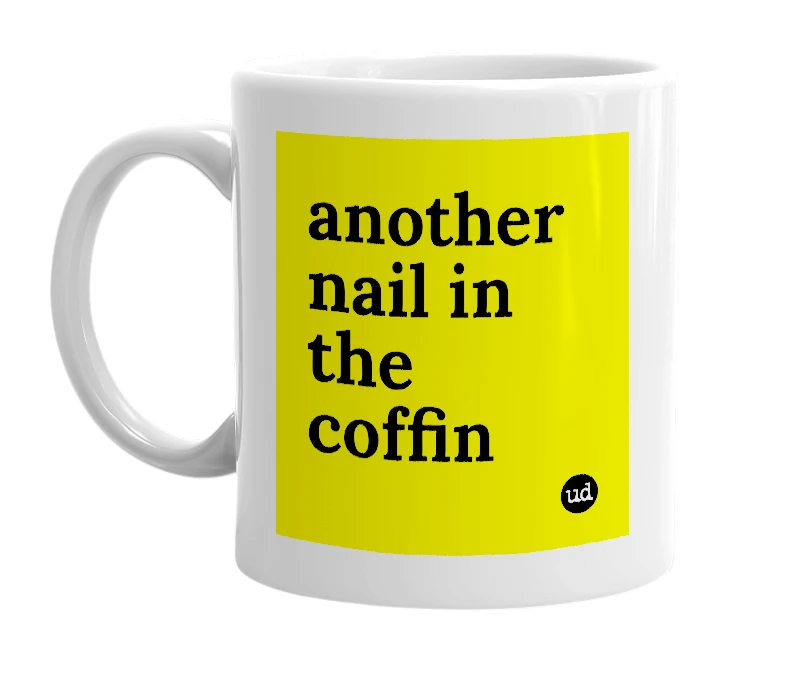 White mug with 'another nail in the coffin' in bold black letters