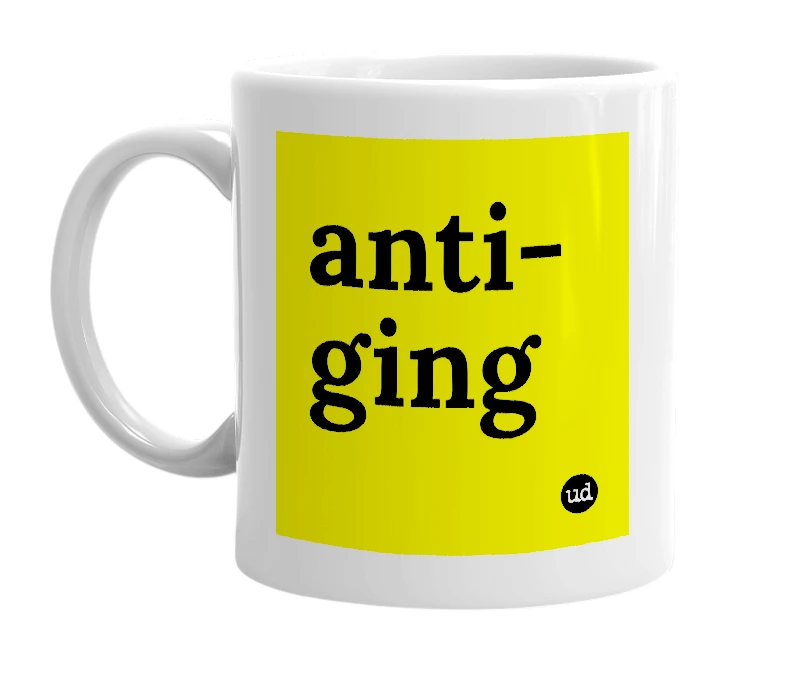 White mug with 'anti-ging' in bold black letters