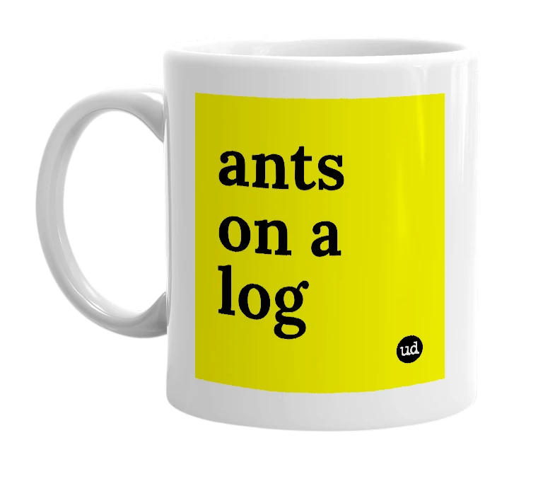 White mug with 'ants on a log' in bold black letters