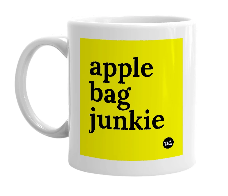 White mug with 'apple bag junkie' in bold black letters