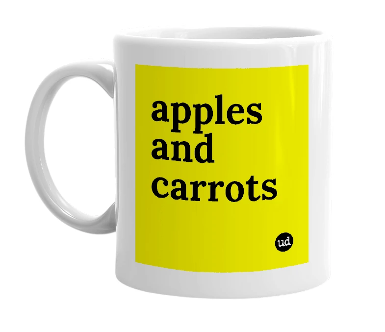 White mug with 'apples and carrots' in bold black letters