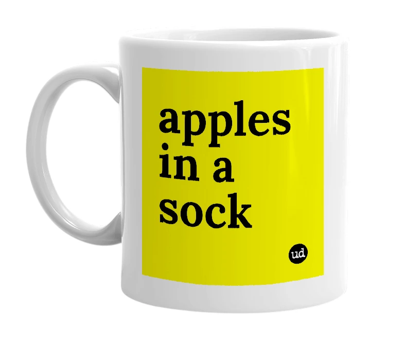 White mug with 'apples in a sock' in bold black letters