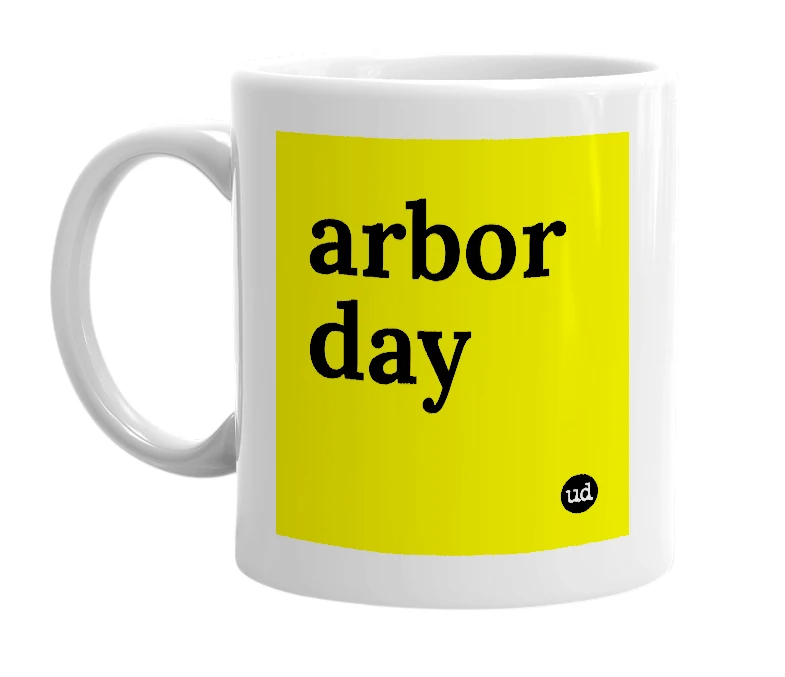 White mug with 'arbor day' in bold black letters