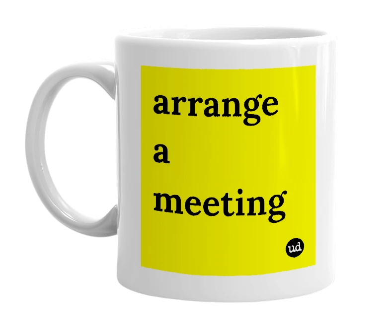 White mug with 'arrange a meeting' in bold black letters